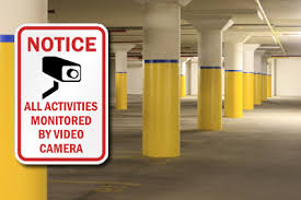 Garage with Security Cameras Sign